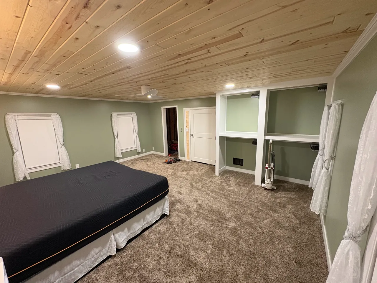 Another angle of the same room showing the finished carpet installation
